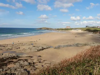 a beach with people on the sand and the ocean at 33 Tre Lowen in Newquay