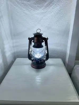 a lantern sitting on top of a table at The Lookout in Carbis Bay