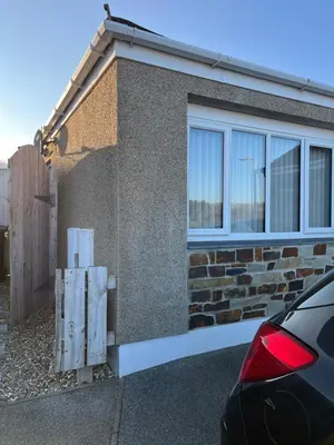 a side view of a house with a window at Hellfire corner in Redruth