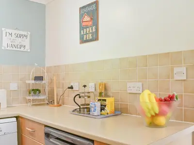 a kitchen counter with a bowl of fruit on it at Dreckly in Falmouth