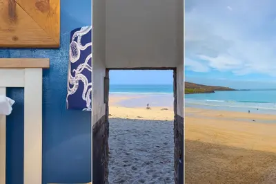 a view of the beach through a door on a beach at The Old Salthouse in St Ives