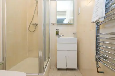 a bathroom with a shower and a sink at The Old Salthouse in St Ives