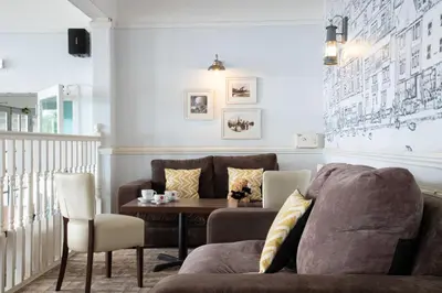 a living room with a couch and a table at The St Ives Bay Hotel in St Ives