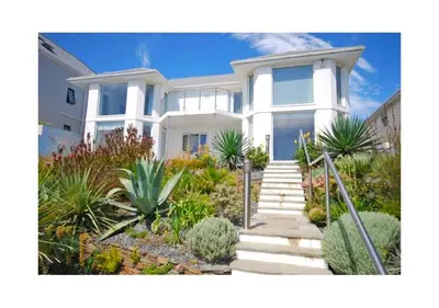 a white house with some plants in front of it at Ocean View, 5 bedrooms sleeps 10, stunning views, parking x4 in Mevagissey