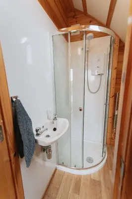 a bathroom with a shower and a sink at Great Tregath by Wigwam Holidays in Camelford