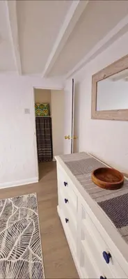 a bathroom with a counter with a wooden bowl on it at Cottage in Newquay