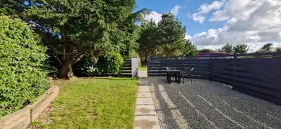 a backyard with a table and a fence at Cottage in Newquay