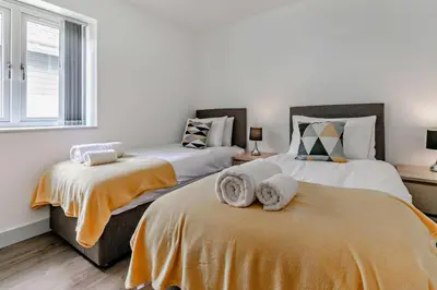 a bedroom with two beds with towels on them at 4 Bed in Retorrick Mill oc-t28899 in Saint Mawgan