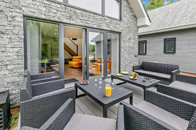 a patio with chairs and tables and a couch at 4 Bed in Retorrick Mill oc-w28897 in Saint Mawgan