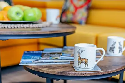 a coffee cup with a deer on it on a table at 4 Bed in Retorrick Mill oc-w28897 in Saint Mawgan