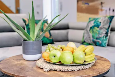 a plate of fruit on a table in a living room at 4 Bed in Retorrick Mill oc-p28898 in Saint Mawgan