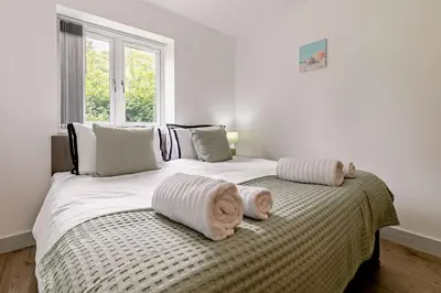 a bedroom with two beds with towels on them at 4 Bed in Retorrick Mill oc-p28898 in Saint Mawgan