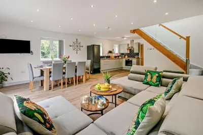 a living room with a couch and a table at 4 Bed in Retorrick Mill oc-p28898 in Saint Mawgan
