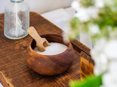 a wooden bowl of milk with a wooden cross in it at Number One in Mevagissey