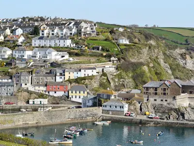 a town on a hill with boats in the water at Number One in Mevagissey