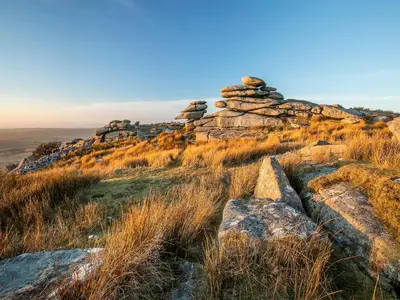 a pile of rocks sitting on top of a hill at Scrumpy Cottage in Bodmin