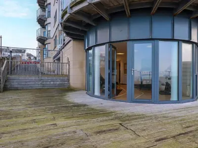 a glass door on the side of a building at Apartment 3 in Newquay