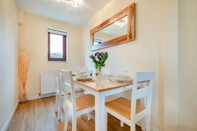 a dining room with a white table and chairs at 2 Bed in Padstow oc-t30052 in Padstow