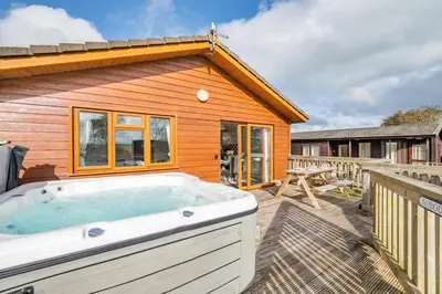 a hot tub on the deck of a house at 3 Bed in St. Merryn oc-r30137 in St Merryn