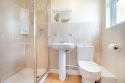 a bathroom with a toilet and a sink and a shower at 3 Bed in St. Merryn oc-r30137 in St Merryn