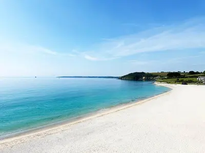 a view of a beach with the blue water at Stylish apartment with parking - Flat 2 Mill House in Penryn
