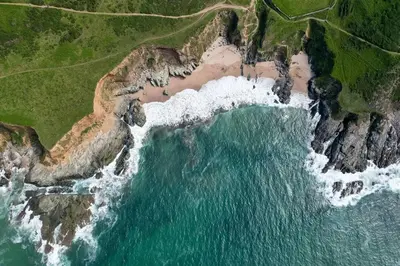 an aerial view of the ocean and a beach at Stylish apartment with parking - Flat 2 Mill House in Penryn