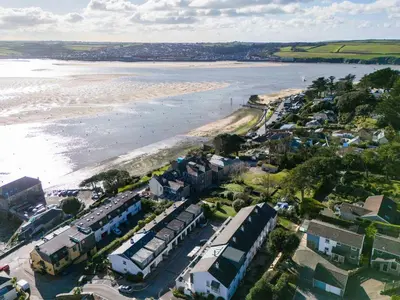 an aerial view of a beach with houses and the water at Slipway 14 in Wadebridge