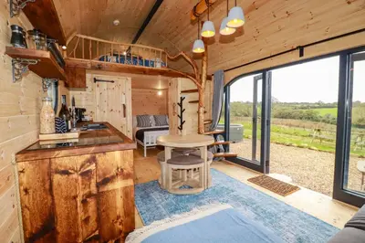 a kitchen and living room in a tiny house at The Palm in Truro