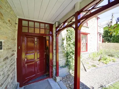 an entrance to a house with a wooden door at Tower Hill in Bodmin