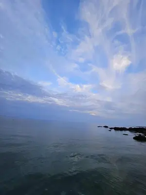a large body of water with a cloudy sky at Fieldhead Hotel, Looe in Looe