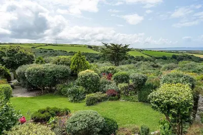 an aerial view of a garden with bushes and trees at Peaceful Home Sea Views Private Parking in Treknow