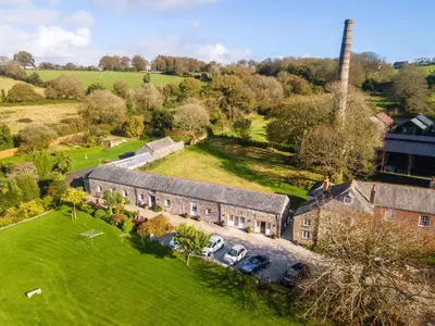 an aerial view of an old house with a chimney at Starfish Cottage in Charlestown