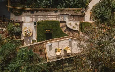 an overhead view of a house with a yard at Topsy Turvy and Hillside Spa at Tregoose Old Mill in Newquay
