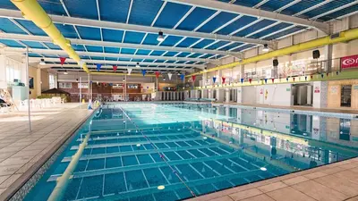 a large swimming pool in a large building at Rubys Retreat - 6 Berth Caravan in Newquay, Cornwall in Newquay