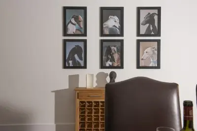 a room with pictures of horses on the wall at Trebyre in Padstow