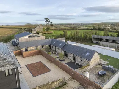 an aerial view of a house with a roof at Trebyre in Padstow