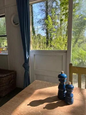 a table with two blue chess pieces on top of it at The Artists Studio in Saint Cleer