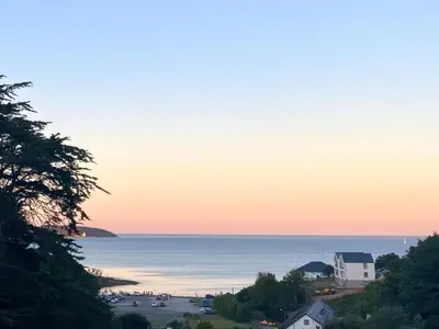 a view of a beach at sunset at Sea Dream in Falmouth