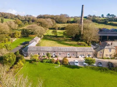 an aerial view of a house with a large yard at Turtle Cottage in Charlestown