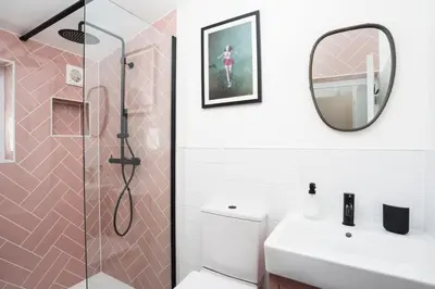 a bathroom with a shower and a toilet and a sink at Gwel Porth - St Ives - Sea Views in St Ives