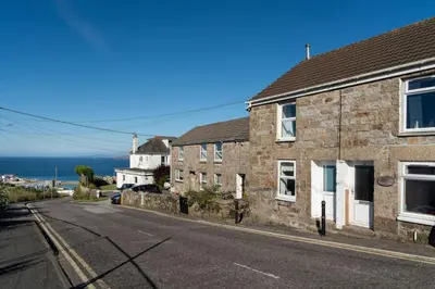 an empty street with houses on the side of the road at Gwel Porth - St Ives - Sea Views in St Ives