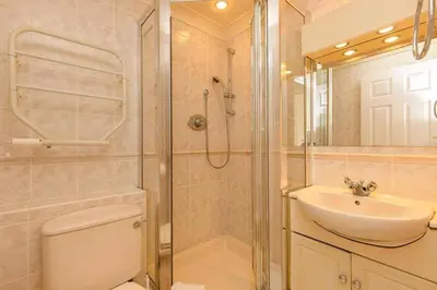 a bathroom with a shower and a sink at Newquay - Atlantic Lodge - 10 - Pets - Pools - Gym in Newquay