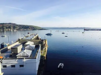 a large body of water with boats in it at Waterside apartment, central Falmouth, Vi-spring king bed, gated parking in Falmouth