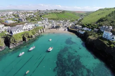 an aerial view of boats in a body of water at Moll's Yard in Port Isaac