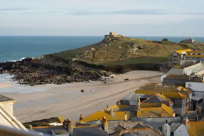 an aerial view of a beach with houses and the ocean at Four Seawinds in St Ives