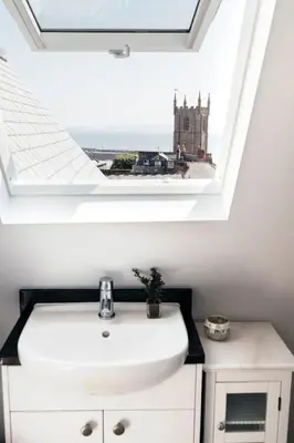 a bathroom with a sink and a skylight at 2 The Elms in St Ives