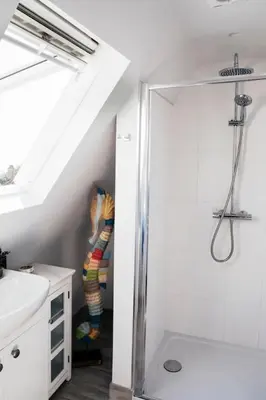 a bathroom with a shower and a sink at 2 The Elms in St Ives