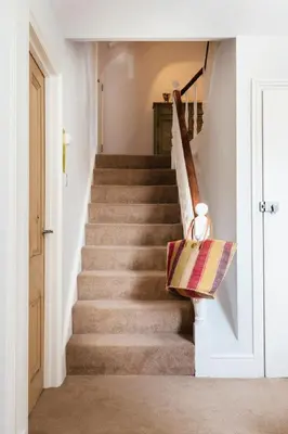 a staircase in a home with a stair case at 2 The Elms in St Ives