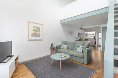 a living room with a couch and a table at 22 Piazza in St Ives