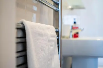 a towel hanging on a towel rack in a bathroom at The Rockpool in Praa Sands